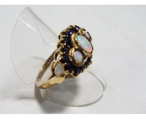 A lady's 9 carat yellow gold sapphire and opal cluster ring, size Q, approx. 5.7 gm - Est £60 - £80