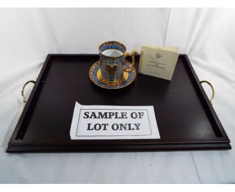 A collection of six cups and saucers depicting Egyptian scenes, cups marked   'The Wonder of the Nile The Golden Mask of  Tut