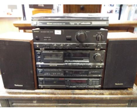 A Technics separate stereo system with automatic turntable SL/L20, a Technics integrated amplifier SU-V460, a Technics stereo