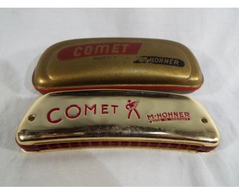 A Comet M. Hohner harmonica with case