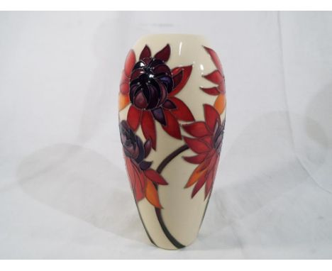 Moorcroft - a Moorcroft vase decorated in the Red Ruby pattern on an ivory ground approx 19cm (h) Est £120 - £150