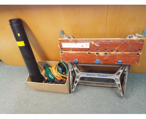 A Black and Decker workbench and a Performance Blower Vac 1800watts, model #PWR1800BVA and a small collection of vintage tool