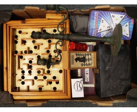 A good mixed lot to include a camera and binoculars, a metal candlestick, a cased backgammon set, chess pieces, The Viking ga