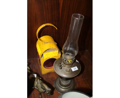 A VINTAGE OIL LAMP WITH DUPLEX BURNER TOGETHER WITH A CARRIAGE LAMP