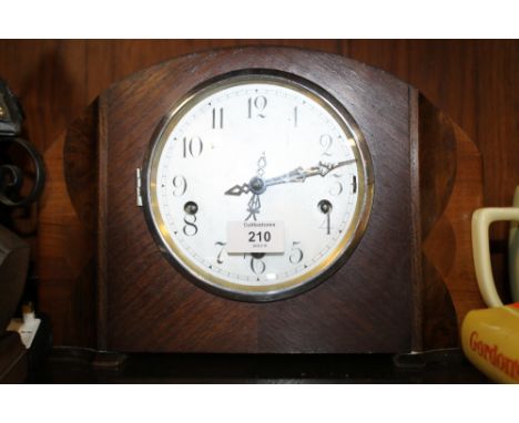 A WESTMINSTER CHIMES OAK MANTLE CLOCK