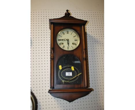 A MODERN 31 DAY WALL CLOCK 