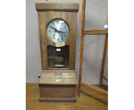 A VINTAGE CLOCK IN TIME RECORDER