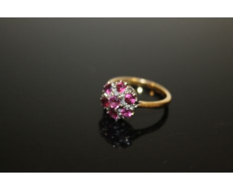 AN 18CT GOLD FLORAL SET SEVEN STONE RUBY LADIES DRESS RING 