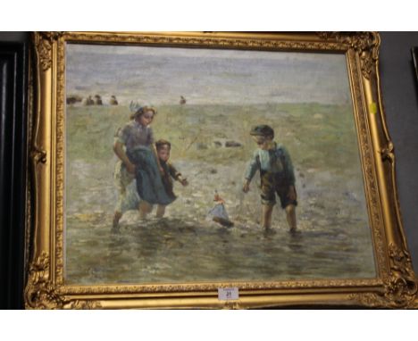 A LARGE GILT FRAMED OIL ON CANVAS DEPICTING CHILDREN PLAYING IN THE SEA SIGNED W.T.