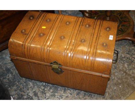 A VINTAGE TIN TRUNK
