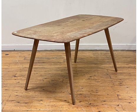 A mid century elm and beech dining table in the style of Ercol, the top with rounded edge raised on square tapered and splaye