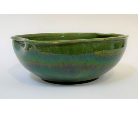 A hand-thrown green glazed earthenware bowl/basin, H15cm, W39.5cm.