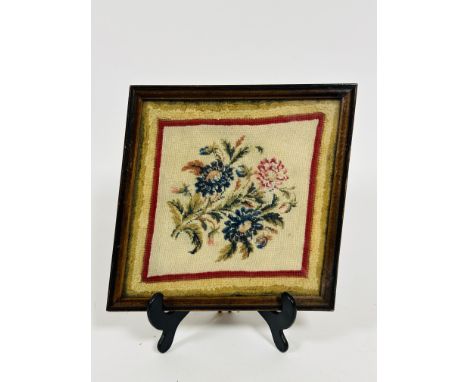 A 19thc sewn work floral panel on linen with Berlin wool style border, with ogee square glazed frame, 18cm x 18cm)