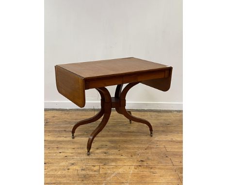 A Regency rosewood sofa table, the cross banded top with brass string inlay over four bowed stretchers leading to inverted sp