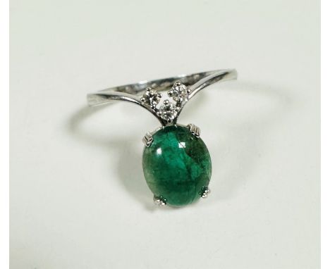 A white metal dress ring mounted oval green jadeite panel, mounted in claw setting, (0.5cm x 0.3cm) mounted three brilliant c