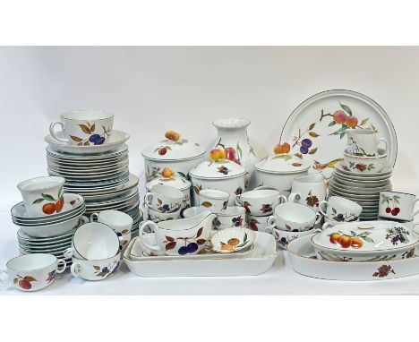 A near complete Royal Worcester Eveshame gold and Eveshame pattern dinner service comprising, seven tea cups, two mugs, four 