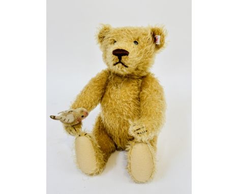 A modern Steiff German plush mohair bear with inset glass black bead eyes, stitched nose and mouth, with articulated joints, 