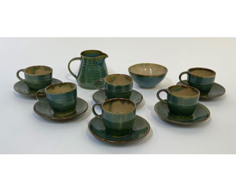 A Yellend pottery jun glazed coffee service, comprising six demitasse cups with saucers, a milk jug and sugar basin (8)