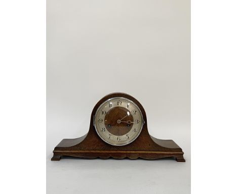 An early 20th century oak cased dome top mantel clock, the silvered dial with Arabic chapter ring, twin train movement striki