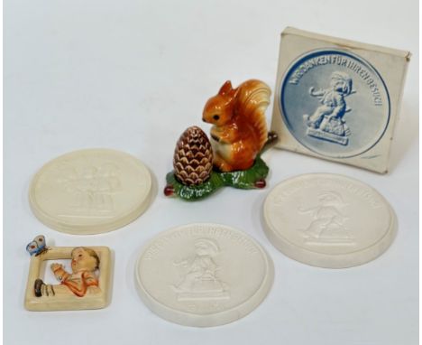 A mixed group comprising three commemorative Hummel molded portrait plaque two with a boy holding an umbrealla and satchel an