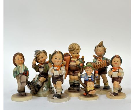 A group of seven Hummel figures comprising "Little Scholar" (h- 15.5cm),  "Apple Tree Boy", "Happy Traveller", "Mountaineer" 