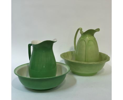 A green ewer and basin decorated with relief moulded flower motifs (jug h- 32cm, basin w- 40cm) (marked verso), together with
