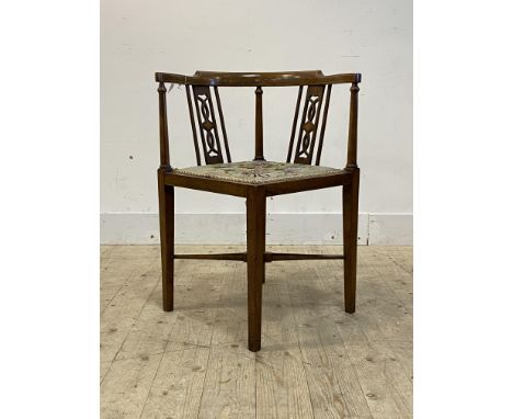 An Edwardian mahogany and beech corner chair, with boxwood stringing and inlay, upholstered seat, raised on square tapered su