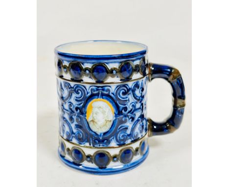 A Doulton pottery Queen Victoria commemorative mug decorated with central portrait in later years to one side, other side sho