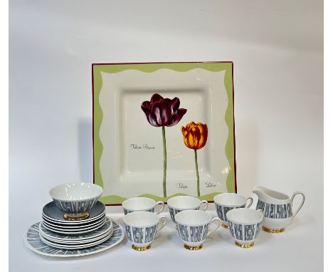 A small Tuscan China tea service in "Manhattan" style comprising six teacups, five saucers, a serving dish, five plates, a mi