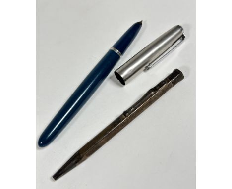 A Parker stainless steel capped fountain pen with teal blue faceted case and a London silver engine turned decorated propelli