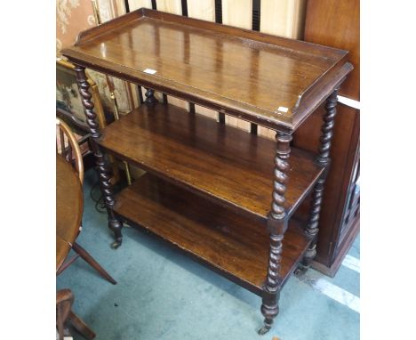 A Victorian three tier buffet with barley twist supports, 113cm high x 91cm wide x 43cm deep Condition Report: Available upon