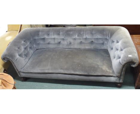 A Victorian grey upholstered Chesterfield three seater sofa with carved feet, 70cm high x 220cm wide x 90cm deep Condition Re