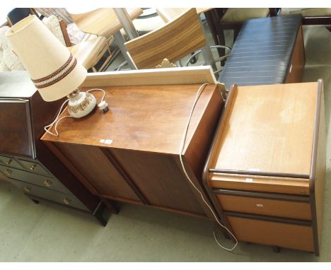 A mid-Century teak TV cabinet with tambour front, 79cm high x 88cm wide x 42cm deep, filing cabinet, blanket chest and a tabl