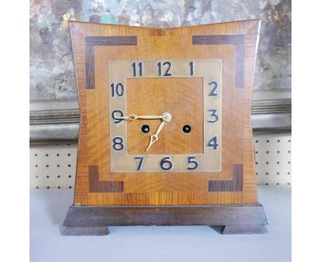 An Art Deco walnut clock, the movement stamped 'times money', H.29 W.28 D.13cm 