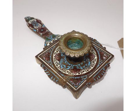 A French enamel chamberstick, polychrome decorated with scrolling foliage, on shaped square base and bracket feet, H.5cm L.20