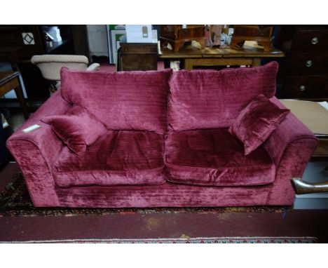 A Heals Red velvet two seat sofa 