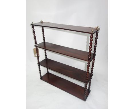 A Victorian mahogany wall hanging shelf, with bobbin turned supports, H.73 W.64 D.17cm 