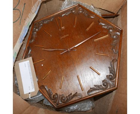 A German Art Deco hexagonal oak wall clock by Junghams, the dial with gilt baton markers and Arabic 12, with pendulum and wei