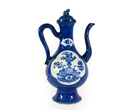 A Chinese Porcelain Ewer and Cover, Kangxi, of pear form with scroll handle and spout, painted in underglaze blue with auspic