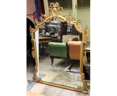 19th century Continental giltwood overmantel with cartouche-shaped plate within guilloche slip with pierced swan and trophy c