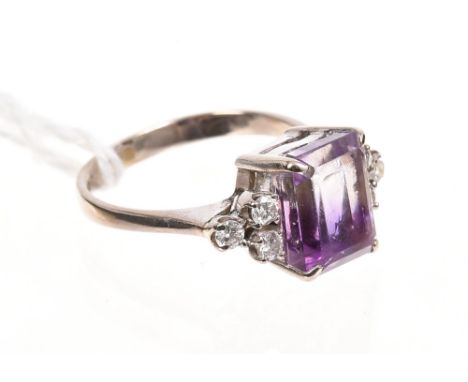 Amethyst and diamond dress ring with a square step cut amethyst flanked by six brilliant cut diamonds in white gold (14ct) se