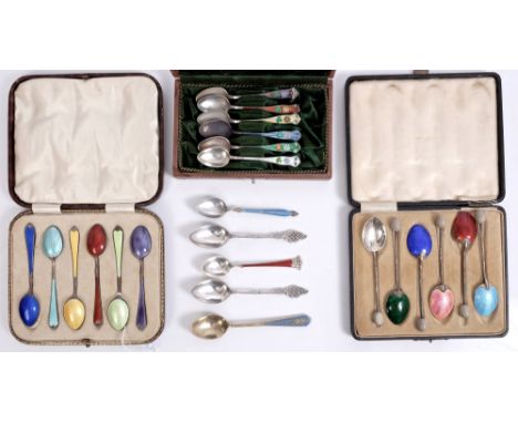Three cases containing a collection of Scandinavian, English and other Continental enamelled silver tea and coffee spoons wit