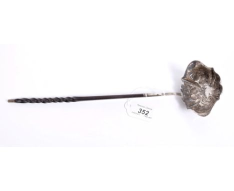 Georgian silver toddy ladle of panelled oval form, with embossed fruit and floral decoration, engraved initial, silver strap 