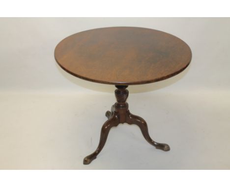 George III mahogany occasional table, the solid circular tilt-top on vase-shaped spiral-twist column and tripod cabriole base