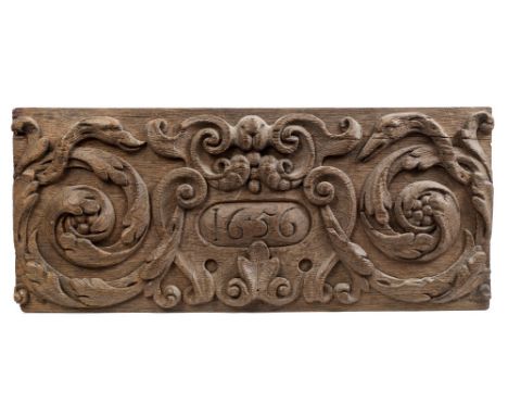 17th century relief carved oak panel with oval cartouche dated 1656 within scrolling acanthus surround, 20cm x 45cm, together