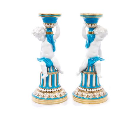 Pair Victorian Minton porcelain candlesticks in the form of putti on columns, with gilt, white and turquoise decoration with 