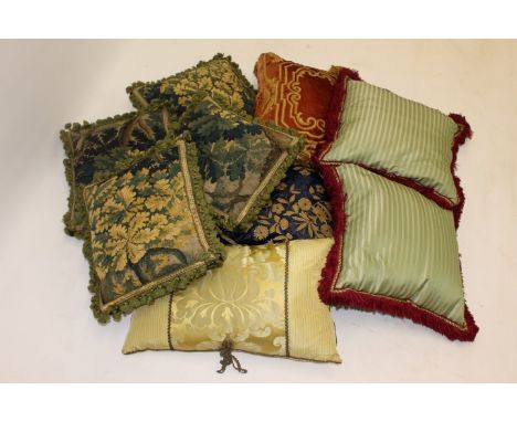 Four cushions with 18th century tapestry covers, together with five other decorative cushions 