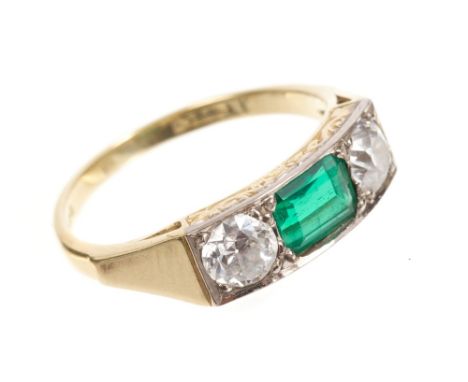 Emerald and diamond three stone ring, the rectangular step cut emerald measuring approximately 6.2mm x 4.8mm x 2.7mm, flanked