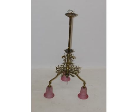 Victorian-style ornate brass ceiling light with central knopped column issuing three scrolling leaf ornamented arms with lion