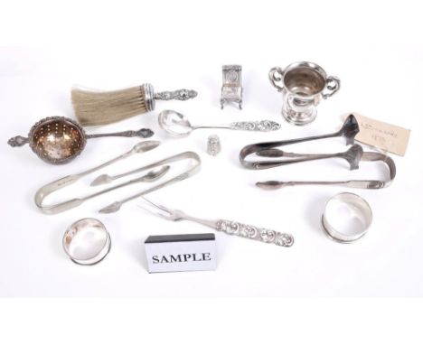 Selection of Victorian and later silver - including pair sugar tongs (Newcastle 1873), three napkin rings, tea strainer, mini